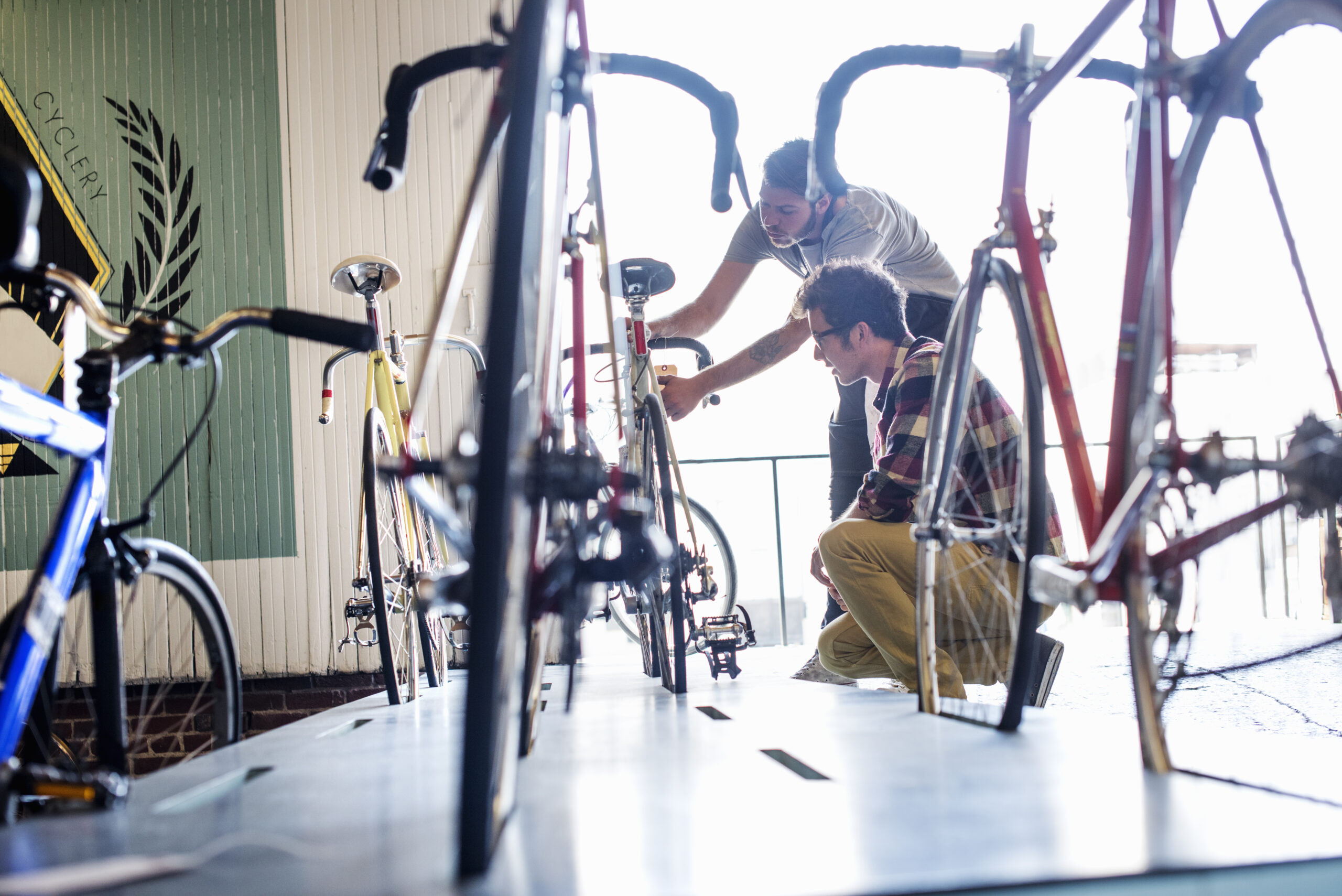 a-man-working-in-a-bicycle-repair-shop-checking-a-2023-11-27-04-53-15-utc-1-scaled_main