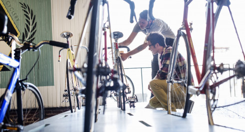 a-man-working-in-a-bicycle-repair-shop-checking-a-2023-11-27-04-53-15-utc-1-scaled_main