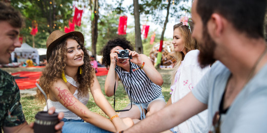 group-of-young-friends-sitting-on-ground-at-summer-2023-11-27-05-31-53-utc-scaled_main