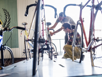a-man-working-in-a-bicycle-repair-shop-checking-a-2023-11-27-04-53-15-utc-1-scaled_main