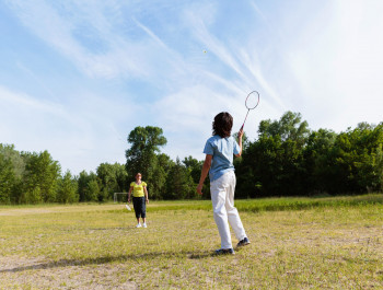 woman-picking-up-shuttlecock-during-badminton-2025-01-27-18-15-07-utc-scaled_main