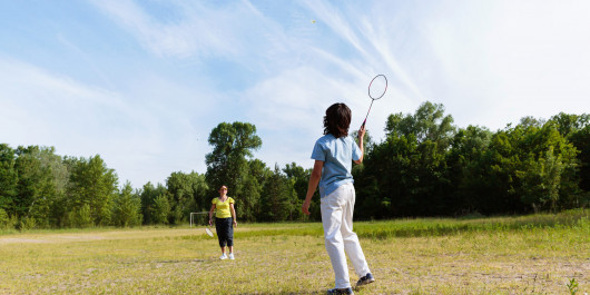woman-picking-up-shuttlecock-during-badminton-2025-01-27-18-15-07-utc-scaled_main
