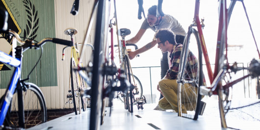 a-man-working-in-a-bicycle-repair-shop-checking-a-2023-11-27-04-53-15-utc-1-scaled_main